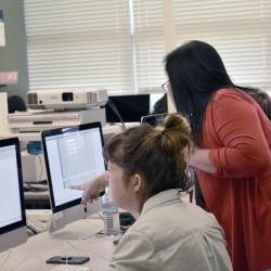 Staff helping students with application process